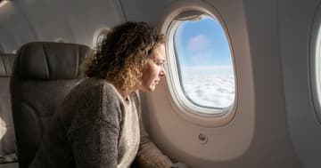 Why airplane windows are curved and have those tiny holes